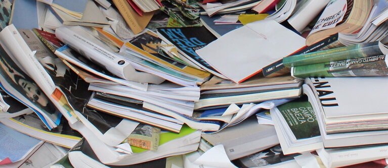 cluttered-pile-of-books cluttered-pile-of-books