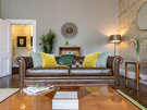 Lounge in a Holiday Rental in Scotland - Cosy living room with a warm ambiance, high-speed internet, and ample space for both University of Edinburgh graduates