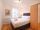 Bedroom - Double bedroom featuring plentiful storage and polished floorboards in Edinburgh self catering accommodation.