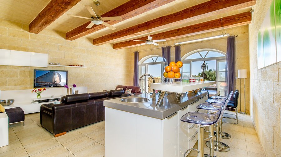 Inside your Gozo Airbnb - A contemporary entire Villa with a top class kitchen and communal island to enjoy breakfast during your holiday, Gozo, Malta.