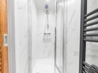 En-suite shower room leading from the double bed