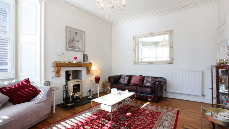 Tilly's House - living room - Living room at Tilly's House with comfortable seating and framed artwork