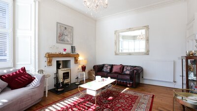 Tilly's House - living room - Living room at Tilly's House with comfortable seating and framed artwork