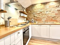 Fully stocked kitchenette.