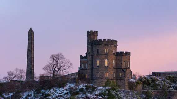 Edinburgh in December - A view of Nelson Monument at Calton Hill in Edinburgh in the snow at sunset.