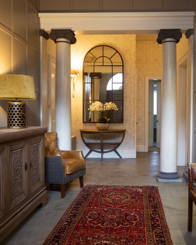 Entrance Hall - The spectacular grand entrance hall features the original flagstone flooring and has wood panelled walls, it is furnished traditionally and has plenty of space to sit down, remove your shoes and put down those shopping bags! (© Ian Paterson)