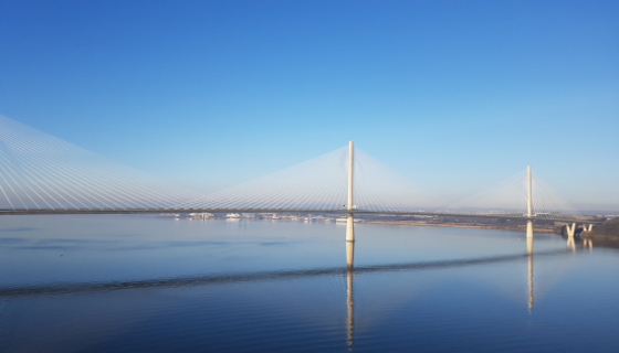 Stay in South Queensferry - The white bridge of Queensferry Crossing spanning the blue Forth River against a blue sky, in South Queensferry.