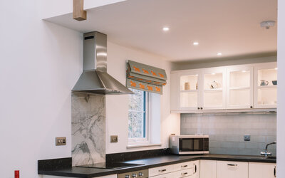 Fully fitted kitchen and dining table with mezzanine gallery above - There's plenty of space for you in the kitchen. It's fully equipped for creating gourmet meals or just snacks.  Dining table next to the kitchen.  And you can see the mezzanine gallery above.