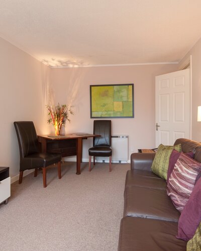 Living Room - Living room, with flat screen TV and dining table in self catering accommodation, Edinburgh.