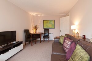 Living Room - Living room, with flat screen TV and dining table in self catering accommodation, Edinburgh.