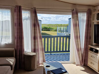 Lounge with TV and Patio Doors to Patio