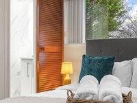 Relaxing bedroom area with en- suite shower room