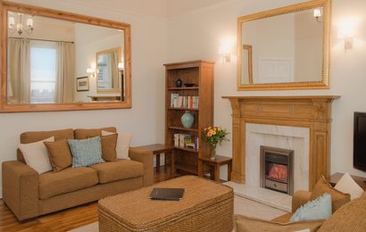 Lynedoch Place 1 - Family living room with decorative fireplace in Edinburgh holiday let