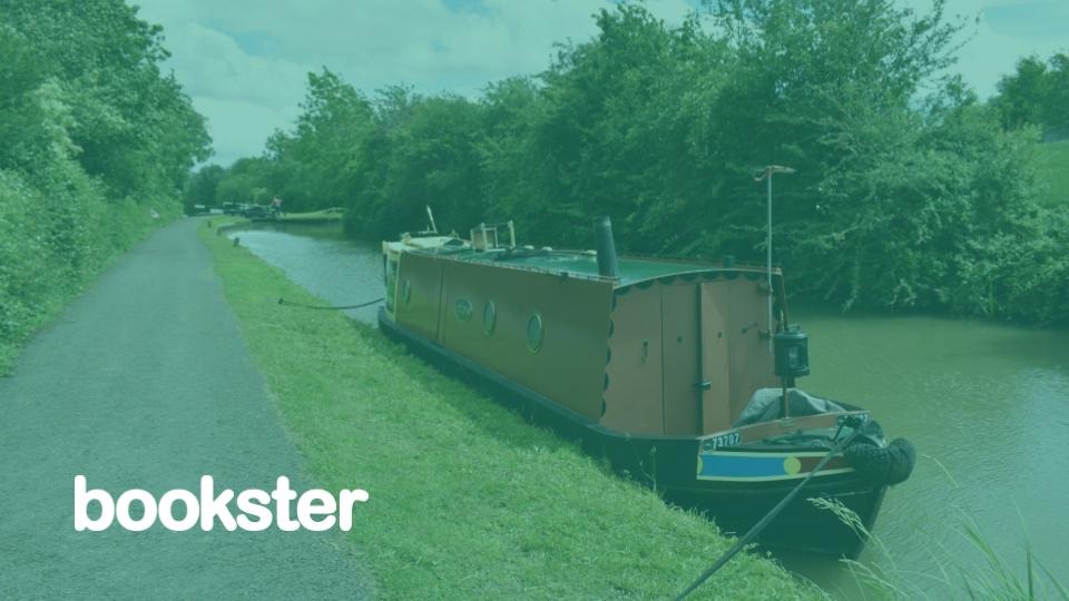 Narrowboat holiday homes - Brown narrowboat on a canal, with a Bookster logo. (© James Homans @ Unsplash) Narrowboat holiday homes - Brown narrowboat on a canal, with a Bookster logo. (© James Homans @ Unsplash)