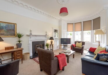 Lauderdale Street 1 - Large family living room with hand picked furnishings and Victorian bay windows