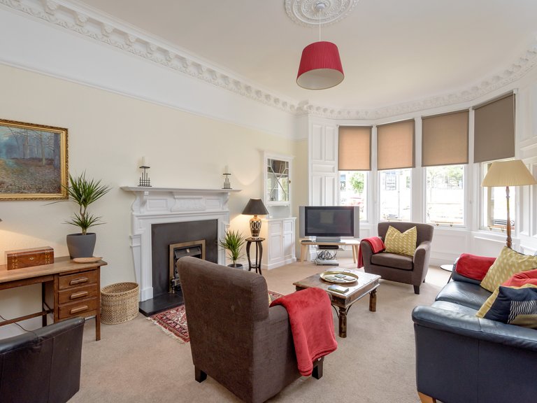 Lauderdale Street 1 - Large family living room with hand picked furnishings and Victorian bay windows