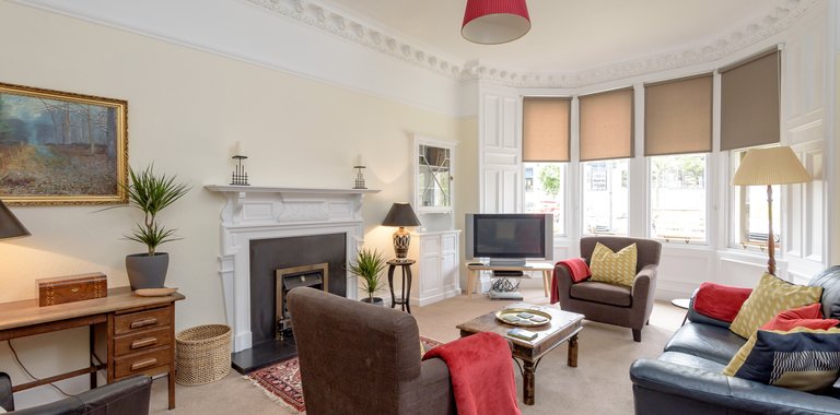 Lauderdale Street 1 - Large family living room with hand picked furnishings and Victorian bay windows