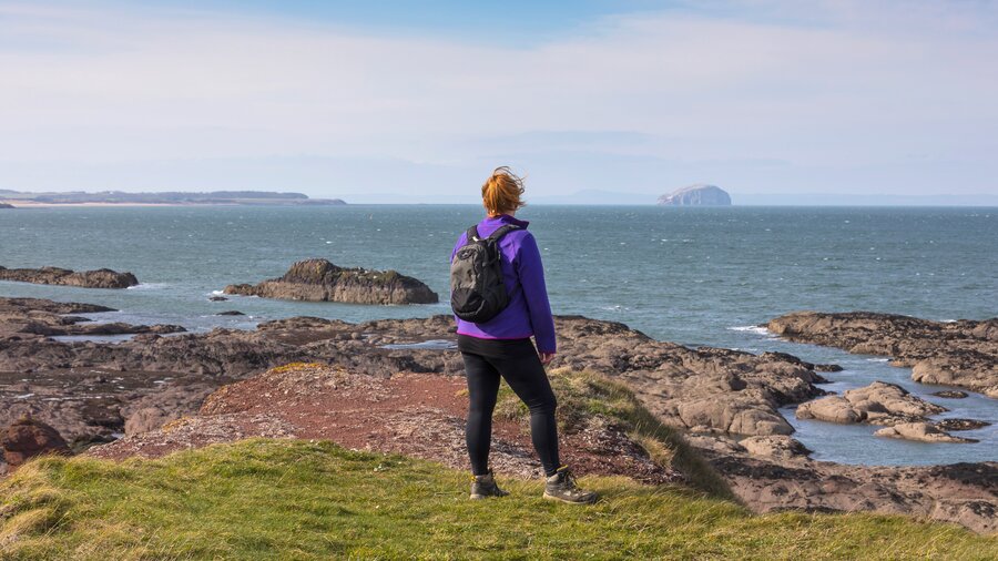 Dunbar Cliff Top Trail - A lady looks out to sea on the Dunbar Cliff Top Trail (© Visit Scotland)