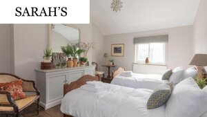 Case Study of Sarah's short stay apartment - Twin bedroom with light walls and two beds. Case Study of Sarah's short stay apartment - Twin bedroom with light walls and two beds.