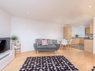 Sandport Way 4 - Spacious, contemporary open plan living room / dining / kitchen featuring designer rug and cushions in an  Edinburgh holiday apartment.