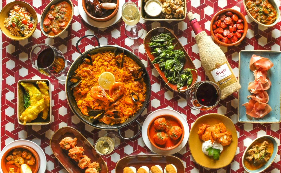 Gluten free food at Cafe Andaluz - A table filled with colourful foods in small bowls.