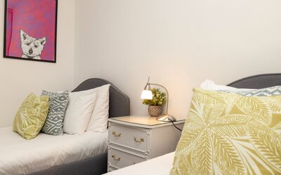 Twin room pic 2  - Double bedroom featuring twin beds, plentiful storage with built-in wardrobes and soft carpeting.