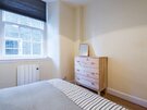 Bedroom - No 70 - Double bedroom with wooden drawers at Haddington holiday let