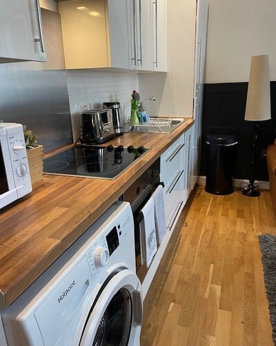 Kitchen area - Fridge freezer, washing machine, oven and hob, microwave, toaster, kettle.