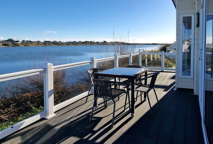 Patio and seating area - Patio with seating area at the front of Boston Lodge with a view out over the water