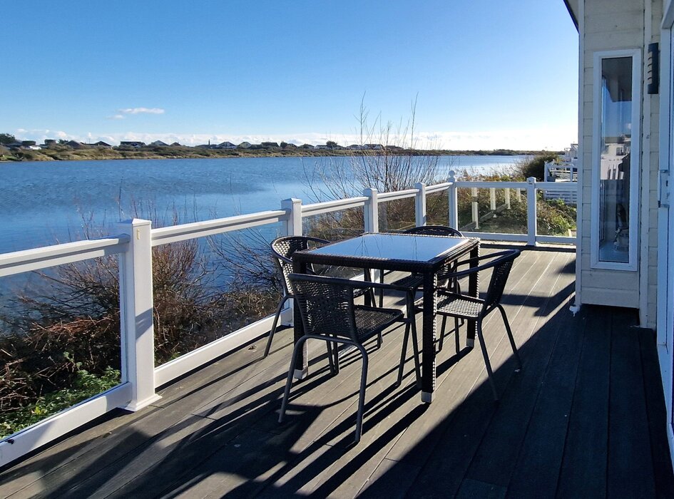 Patio and seating area - Patio with seating area at the front of Boston Lodge with a view out over the water