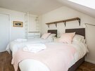 Double bedroom - Seaview Loft - Double bedroom with 'zip and link' beds and decorative cushions